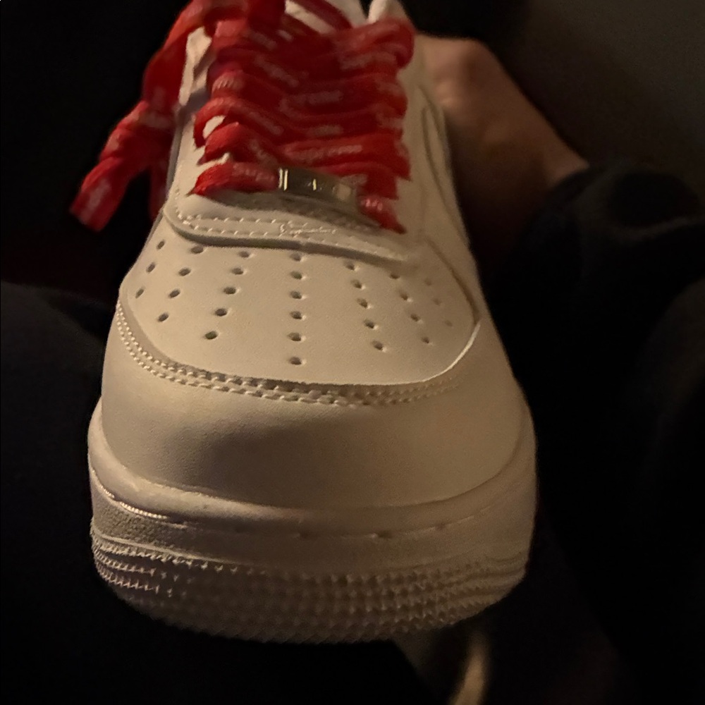 Supreme White Sneakers with Red Accents